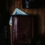 brown leather bifold wallet on brown wooden table